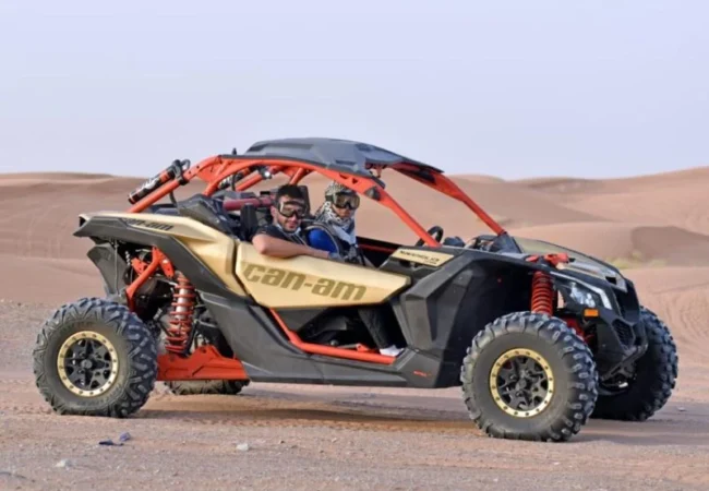 Can-Am Maverick X3 desert buggy on red sand outside Dubai