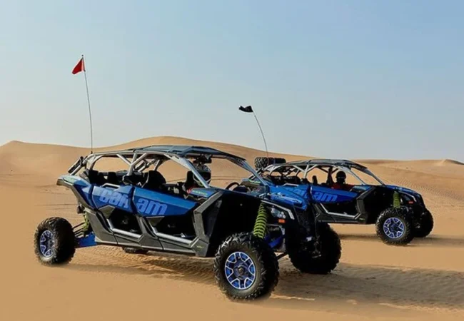 Can-Am X3 RS Turbo RR four-seater buggy on a Dubai dune crest