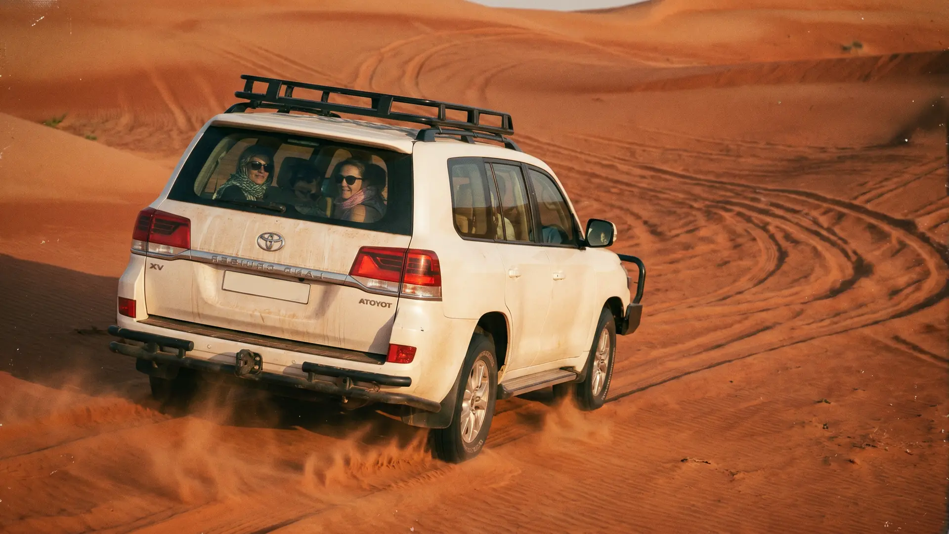Morning desert safari Land Cruiser on the red dunes near Dubai