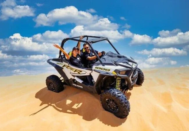 Polaris RZR turbo dune buggy on the Lahbab red dunes near Dubai