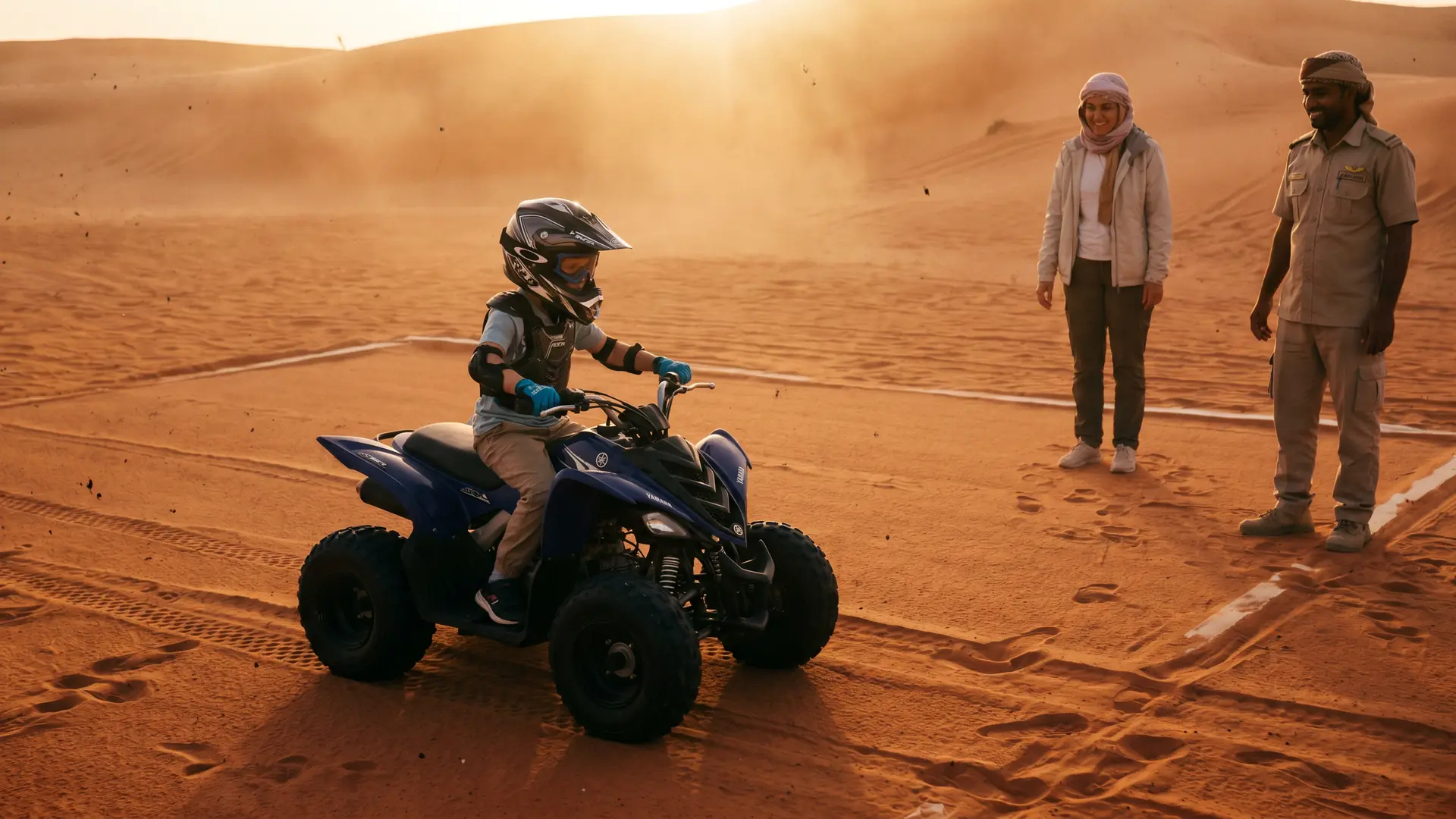 Child riding a supervised 90cc quad bike on a track in the Dubai desert